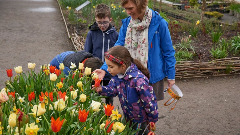 Family in the garden in spring at Attingham Park